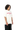 Side angle of female model in We Are Gods 22 oversized off-white t-shirt – cotton blend with bold red flock print, South African design.