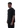Male model side profile wearing plain black t-shirt with relaxed fit.