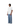 Male model full-body angled view wearing plain white oversized t-shirt with blue wide-leg pants.