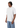 Male model angled side profile wearing plain white oversized t-shirt.